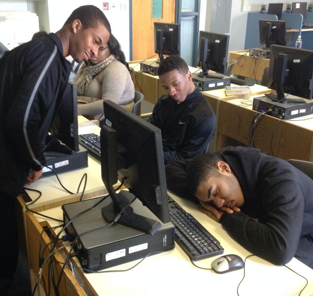 Elijah Muhammed and Reggie Slaughter look on disapprovingly as Calvin Bruce attempts to sleep in class. 