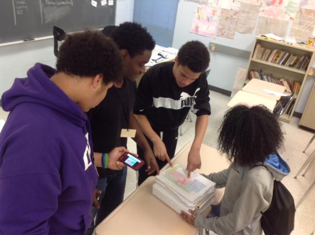 Sophomores (l. to r.) Isaiah Hughes, Noah Caillouet, Courtney Floyd, and Jamilah Board make use of both paper and cell phones to help them study for a chemistry exam.